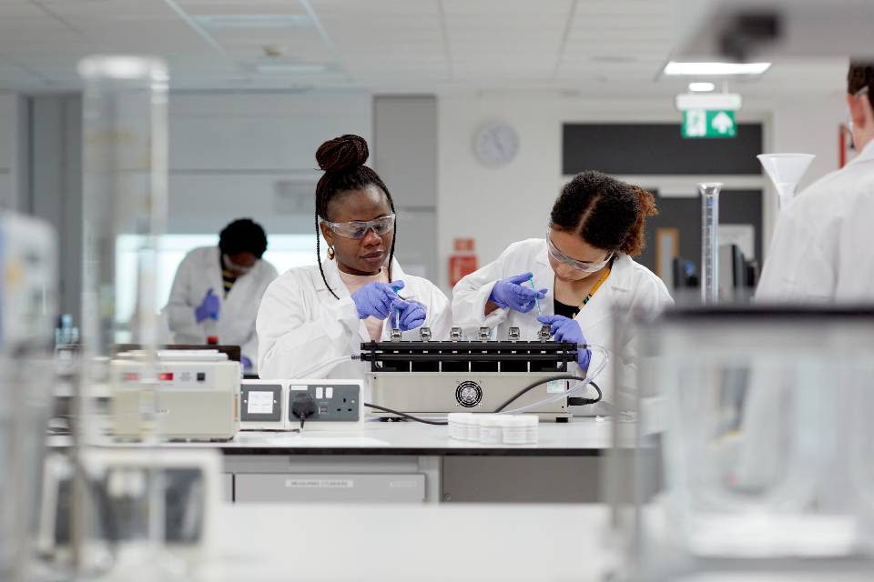 Pharmacology students working in laboratory 